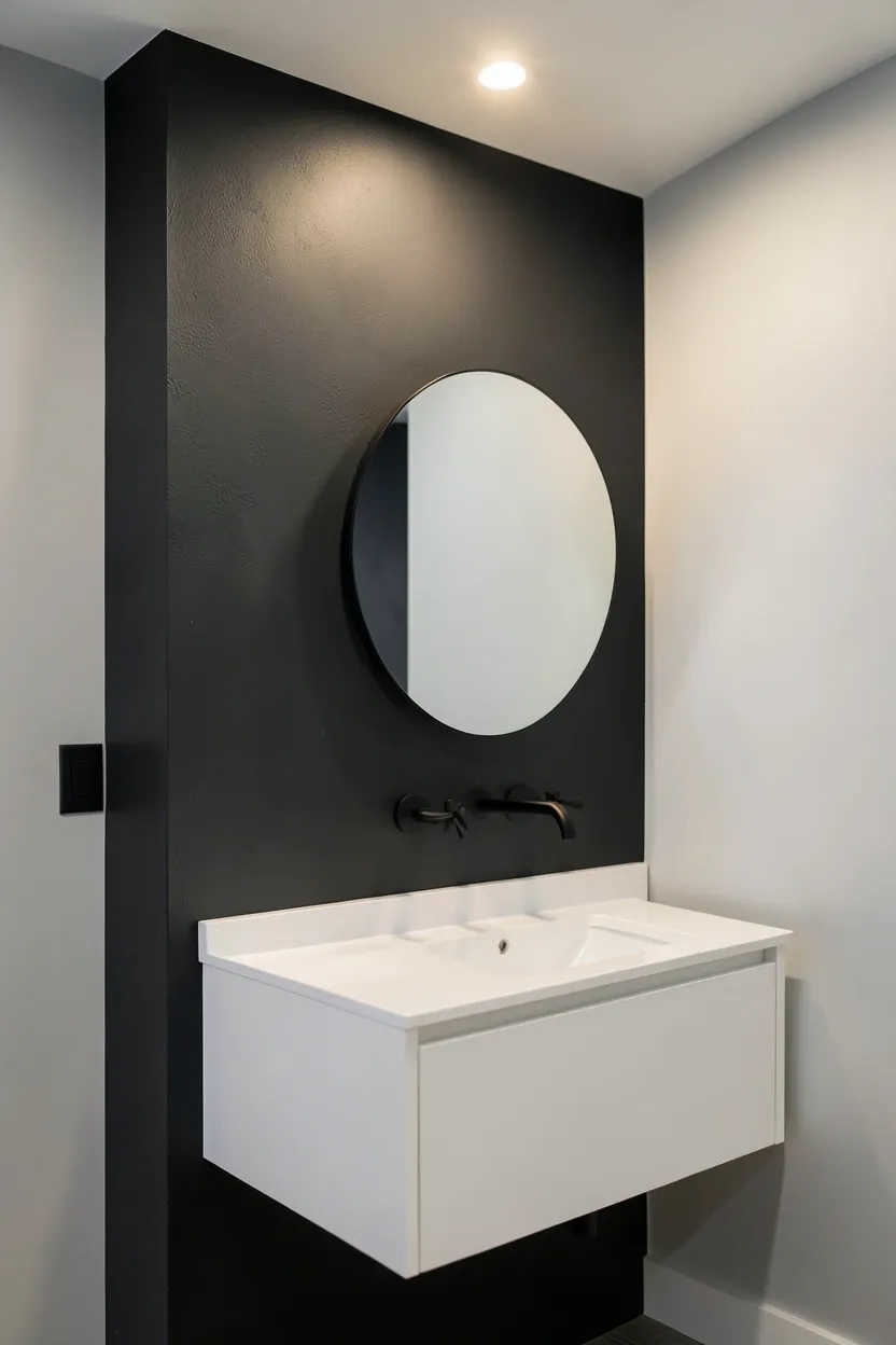 Two-tone grey bathroom with light grey walls and a darker charcoal feature wall behind the vanity