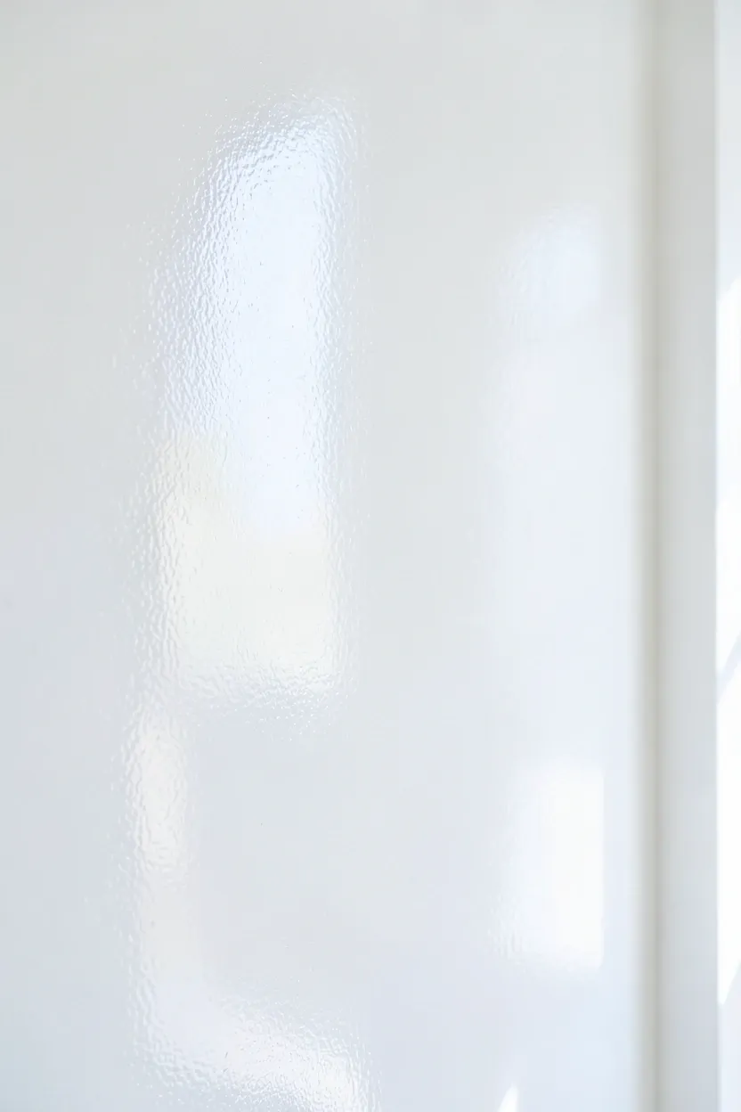 Bright white walls with soft sheen paint reflecting natural light in a tiny Scandinavian apartment living room